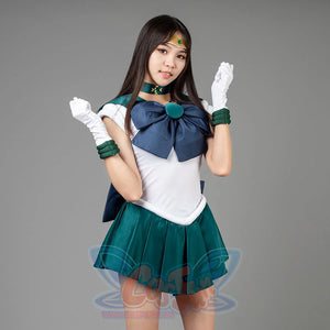 Sailor Moon Sailor Neptune cosplay costume angled pose lifts white gloves beside a navy bow and emerald pleats.