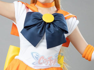 Close-up of the Sailor Venus Aino Minako cosplay costume bow, navy fabric circling a round yellow center