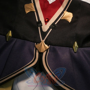 Front panel detail of Sandrone cosplay costume with black fabric, burgundy strap, gold trim, and hanging gold piece