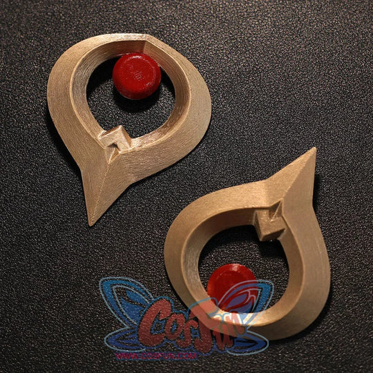 Flat lay of Sandrone cosplay costume gold ornaments with red round centers and curved metal-look shapes