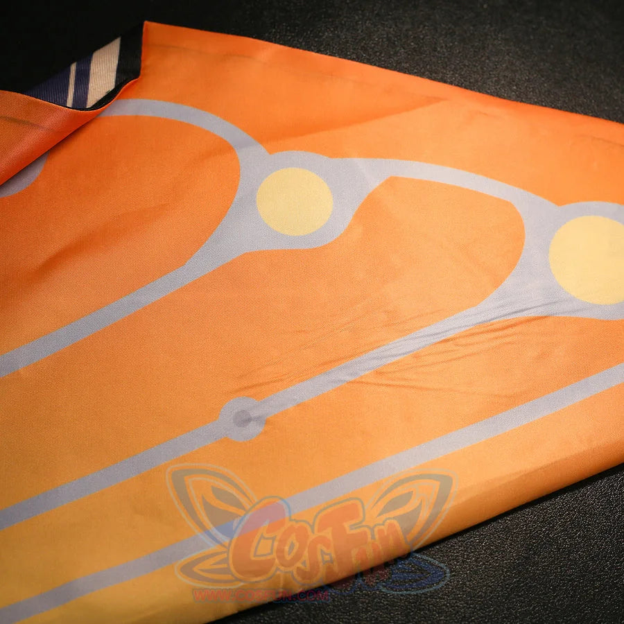 Orange fabric print detail of Sandrone cosplay costume with pale line pattern and round gold accents