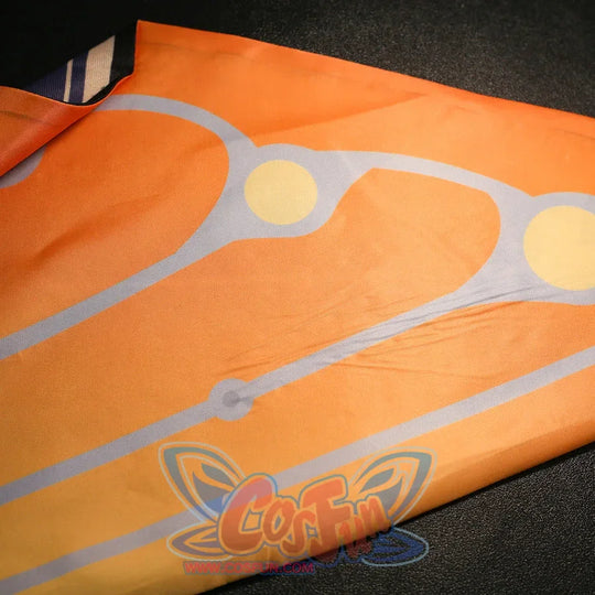 Orange fabric print detail of Sandrone cosplay costume with pale line pattern and round gold accents