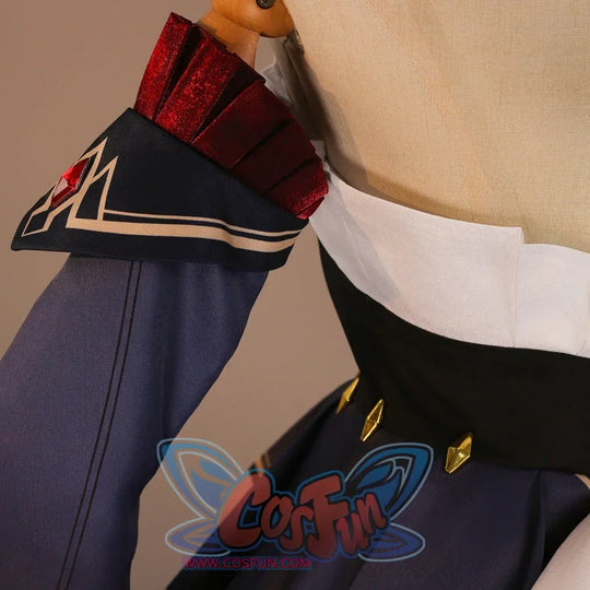 Shoulder sleeve detail of Sandrone cosplay costume with navy sleeve, red shoulder band, beige trim, and black panel