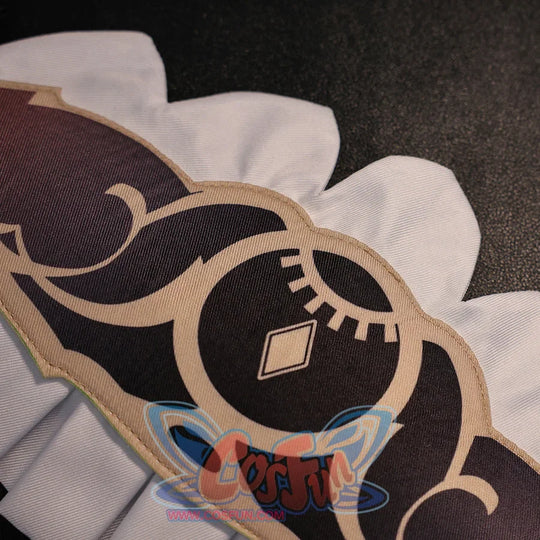 Close-up of Sandrone cosplay costume skirt pattern with black printed motif, beige trim, and white scalloped edge