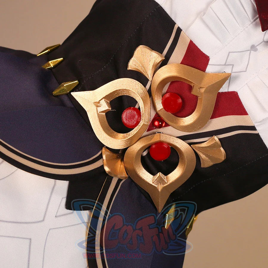 Waist brooch close-up of Sandrone cosplay costume with gold ornament, red gems, navy skirt, and burgundy strap