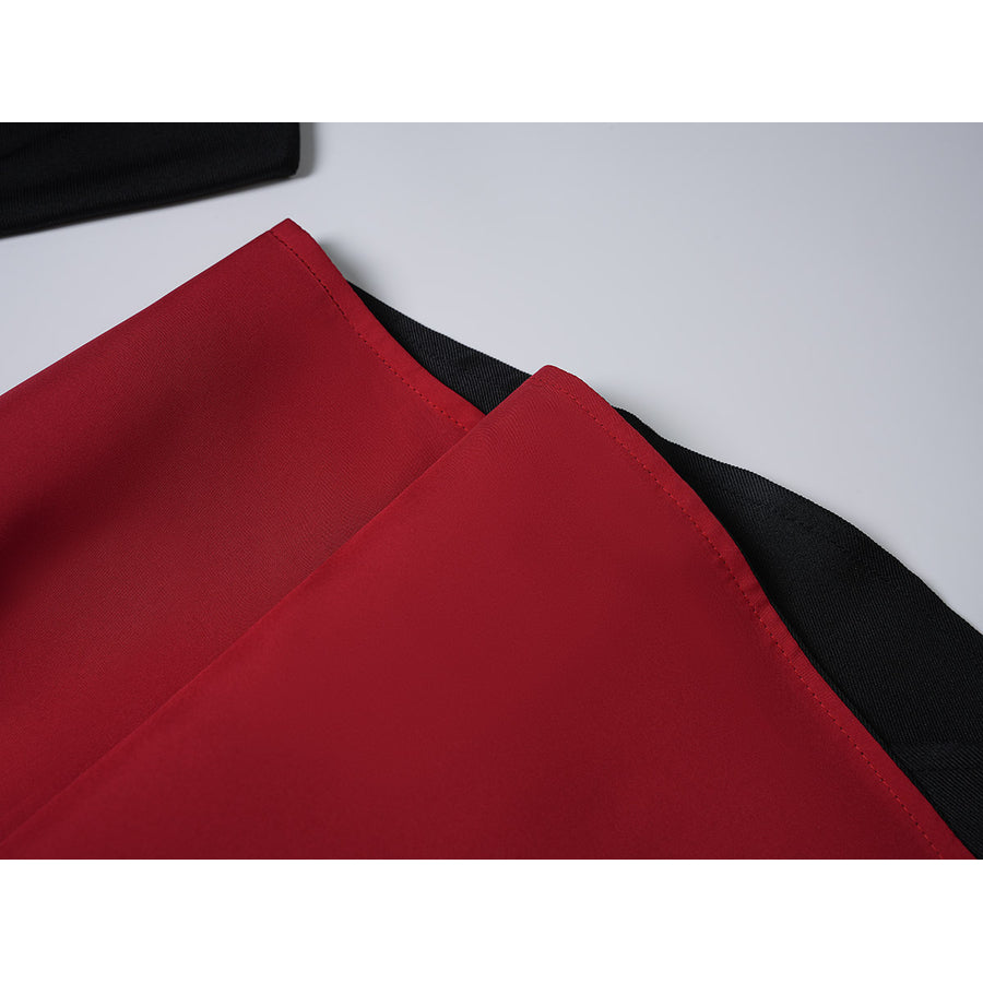 Sapphire cosplay costume layers vibrant red fabric panels over a darker black textile base to create a clean hemline edge.