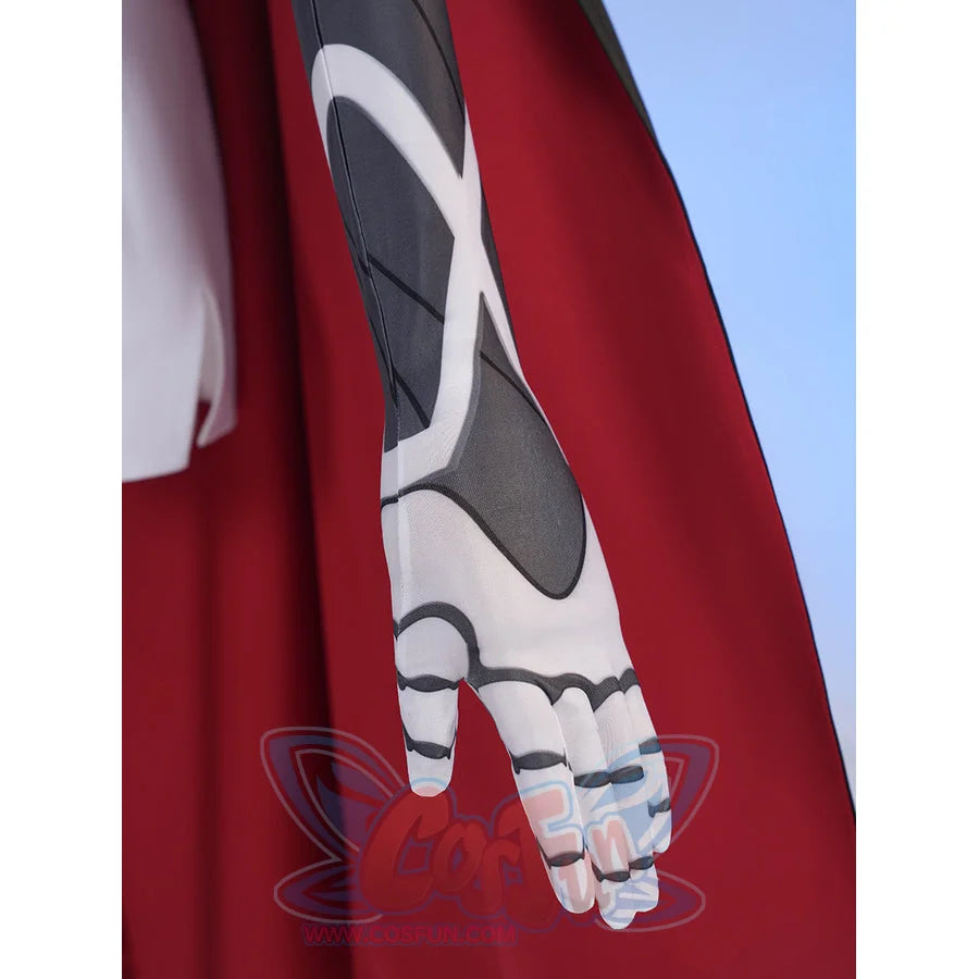 Sapphire cosplay costume layers patterned fabric on the fitted sleeve and matching fabric glove against a red capelet.