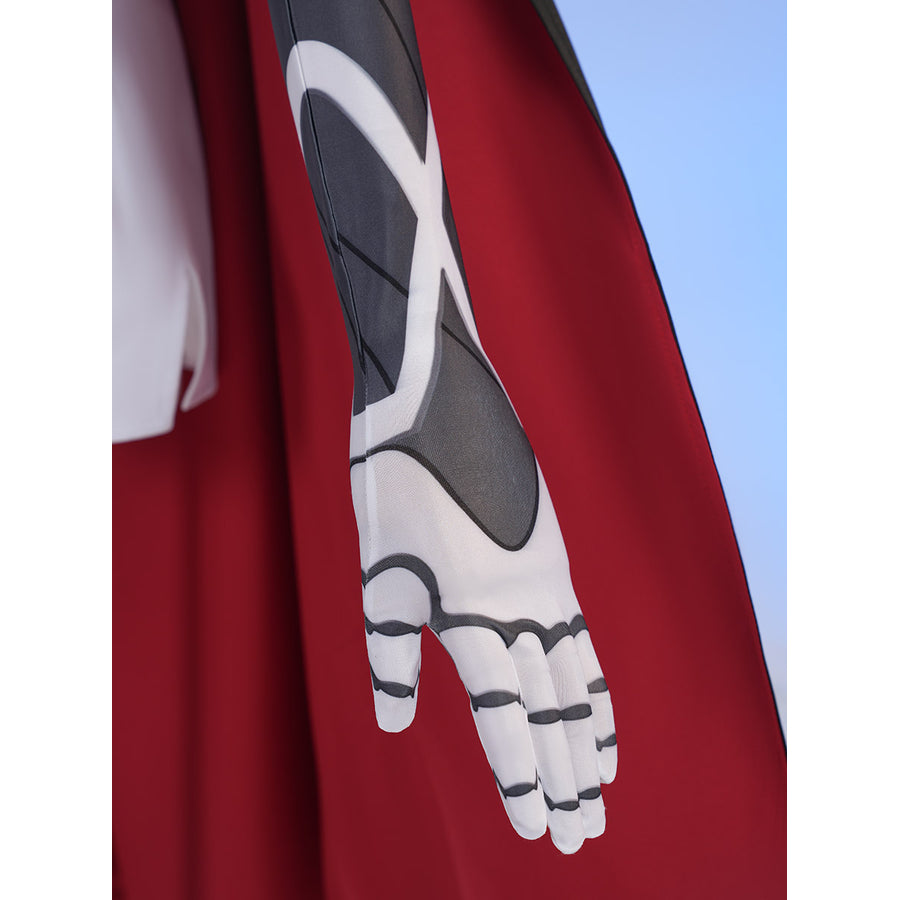 Sapphire cosplay costume layers patterned fabric on the fitted sleeve and matching fabric glove against a red capelet.