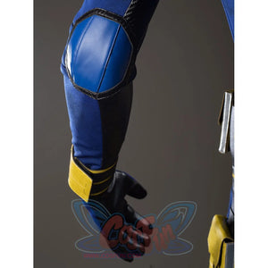 Scott Summers cosplay sleeve detail frames a blue elbow pad in black trim above the yellow wristband.