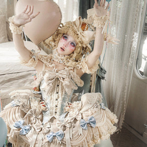 Seated styling with cream lace, blue accents, and layered ruffles