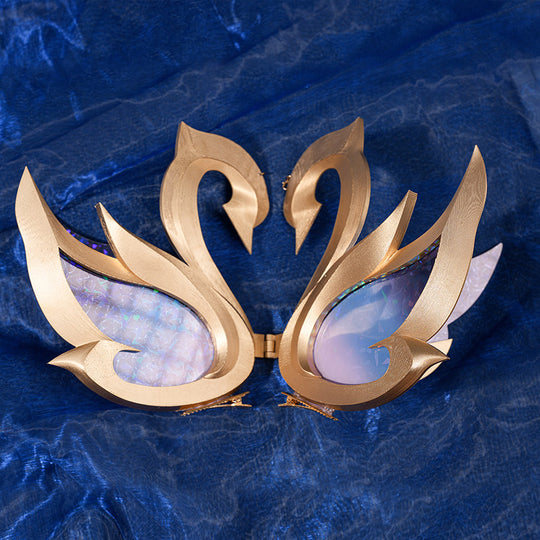 Genshin Impact Snezhnaya Odette cosplay costume swan prop close-up pairs gold-tone wings beside glossy blue panels.