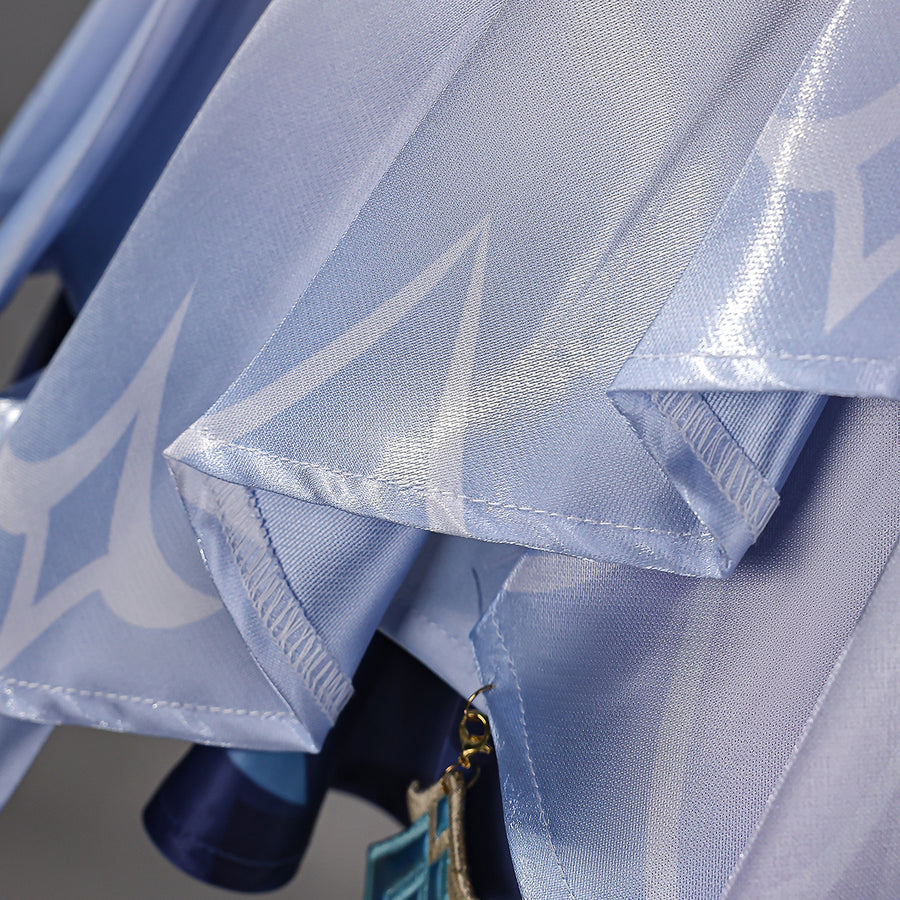 Genshin Impact Snezhnaya Odette cosplay satin hem detail folds pale blue fabric beneath translucent layers.