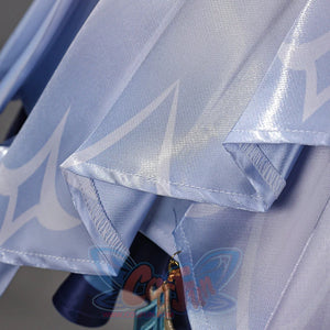 Genshin Impact Snezhnaya Odette cosplay satin hem detail folds pale blue fabric beneath translucent layers.