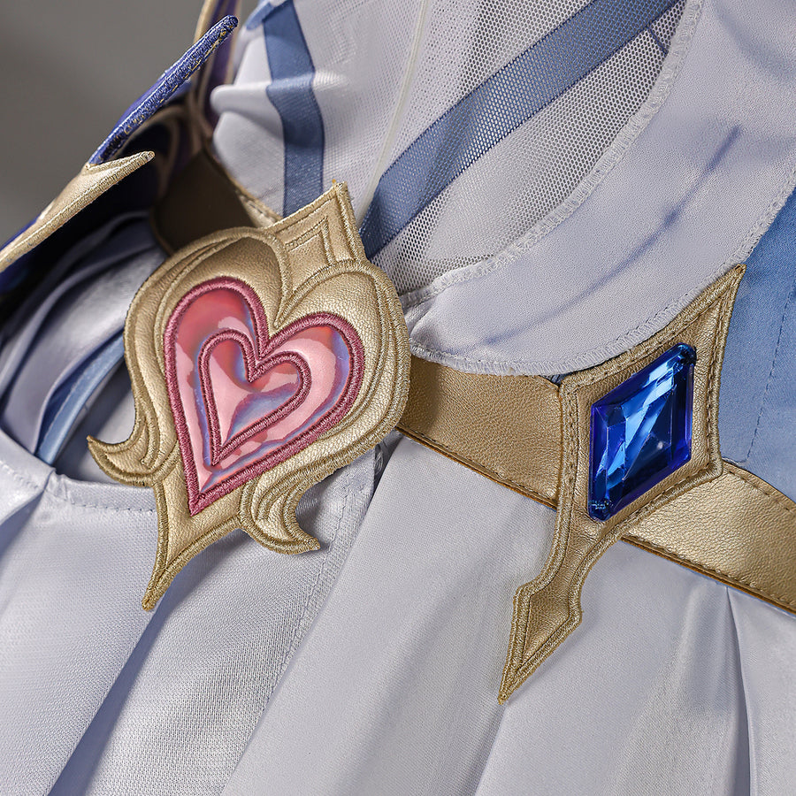 Genshin Impact Snezhnaya Odette cosplay heart ornament close-up pairs a pink center beside a blue waist accent.