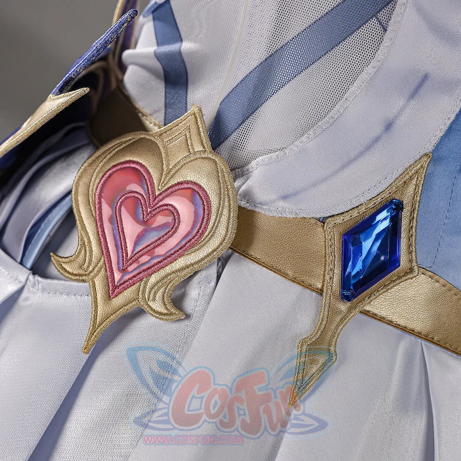 Genshin Impact Snezhnaya Odette cosplay heart ornament close-up pairs a pink center beside a blue waist accent.