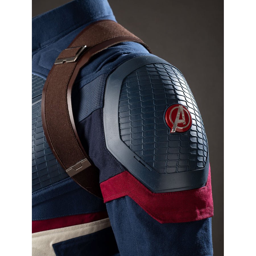 Steve Rogers cosplay shoulder armor detail sets a red emblem against textured navy panels.
