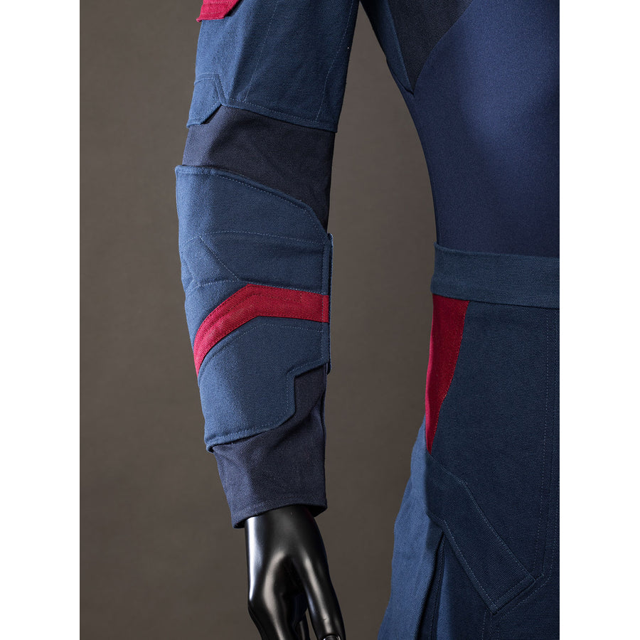 Steve Rogers cosplay sleeve detail layers red bands over navy armor panels near the wrist.