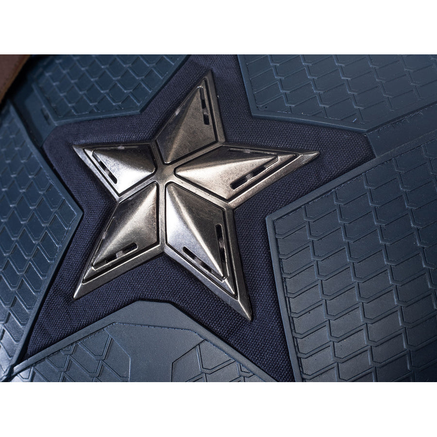 Steve Rogers cosplay chest emblem close-up sets a silver-tone star on textured navy armor.