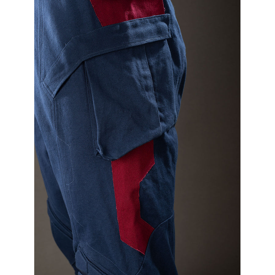 Steve Rogers cosplay trouser side detail sets a cargo pocket above angular red thigh panels.