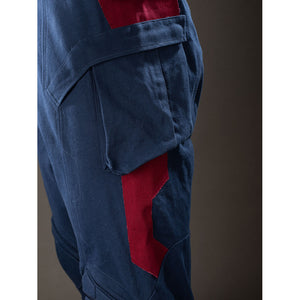 Steve Rogers cosplay trouser side detail sets a cargo pocket above angular red thigh panels.