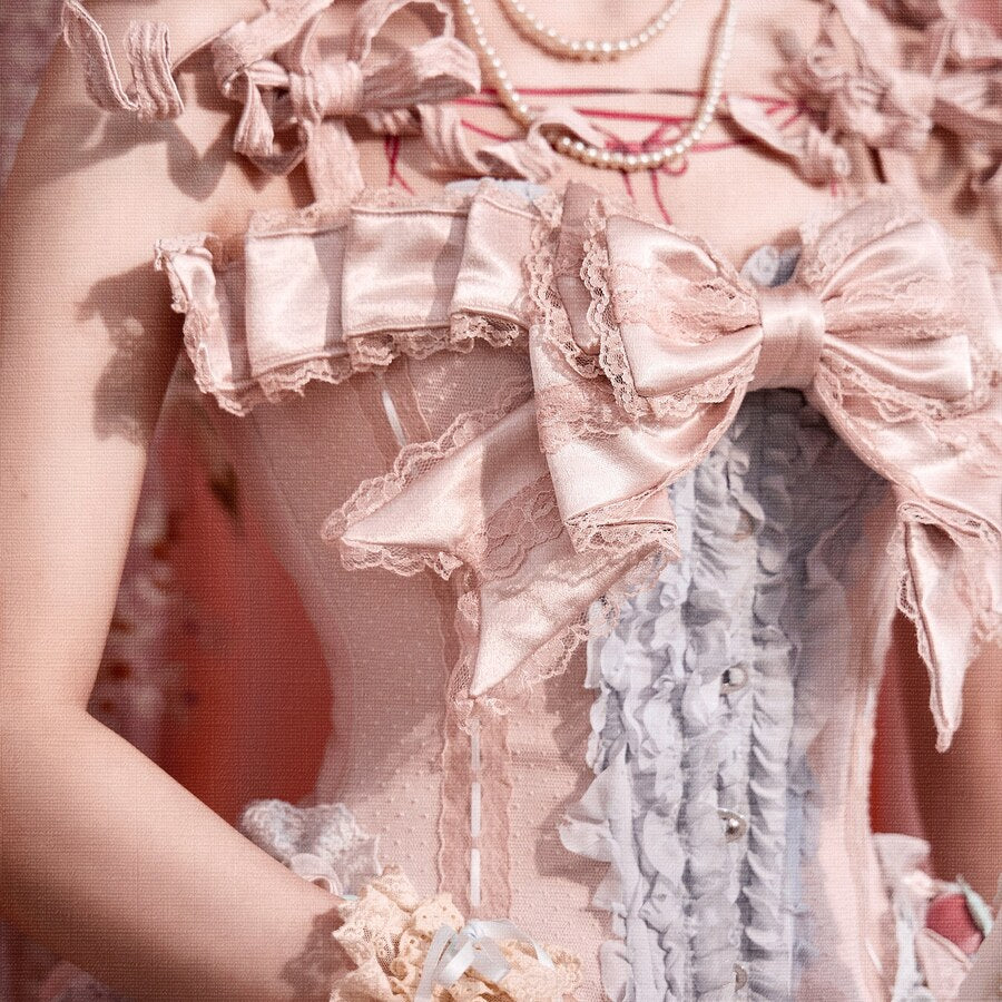 Detail view of the removable bow trim and pink satin corset ruffles