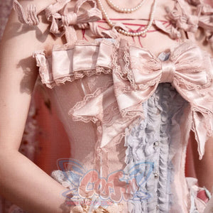 Detail view of the Strawberry Mousse Corset removable bow trim and pink satin ruffles