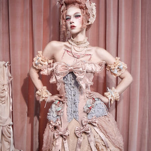 Front view of the Strawberry Mousse corset top with layered satin bows and lace trim