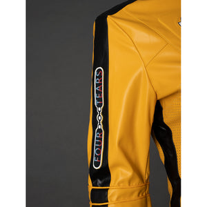 Close-up of The Bride cosplay jacket sleeve with black stripe, vertical text patch and yellow shoulder seam