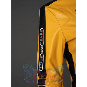 Close-up of The Bride cosplay jacket sleeve with black stripe, vertical text patch and yellow shoulder seam