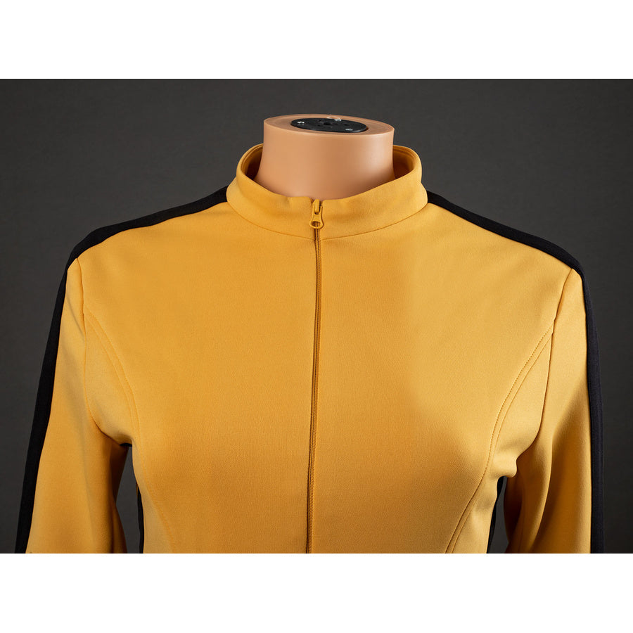 Close-up of The Bride Cosplay jacket collar and zipper with yellow fabric, chest seams and black shoulder stripes