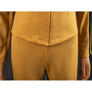 Close-up of The Bride Cosplay jacket hem with lower zipper, curved stitching and yellow pants front rise