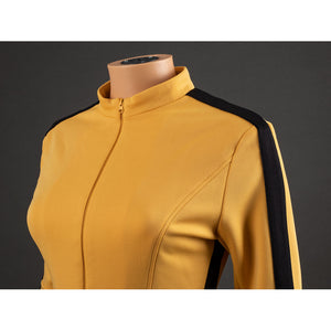 Detail of The Bride Cosplay jacket shoulder with black sleeve stripe, yellow fabric texture and curved chest seam