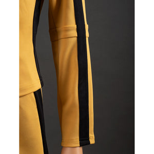 Close-up of The Bride Cosplay jacket sleeve with black vertical stripe, yellow cuff stitching and forearm seam