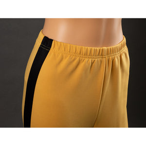 Close-up of The Bride Cosplay pants waistband with yellow elastic fabric and black side stripe at the hip