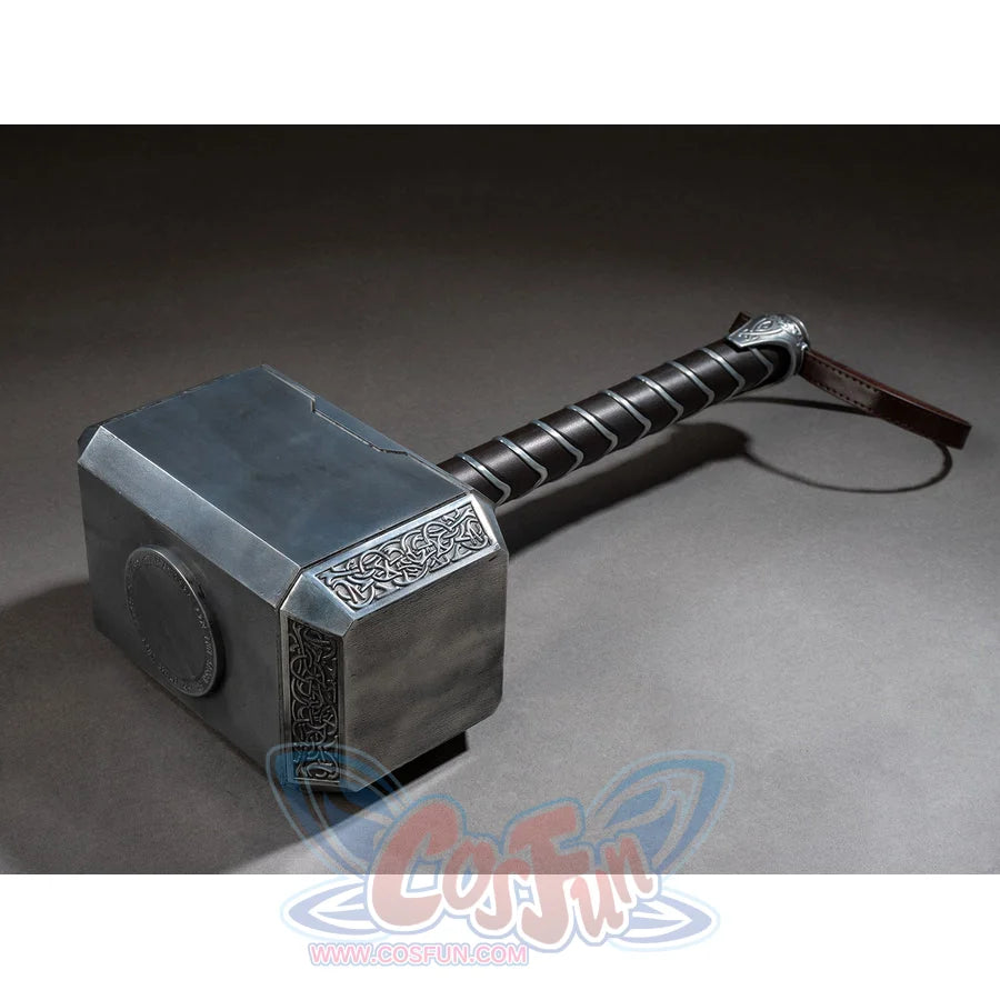 Thor cosplay hammer centers the etched metal block while a dark wrapped handle curves toward a brown faux leather loop.