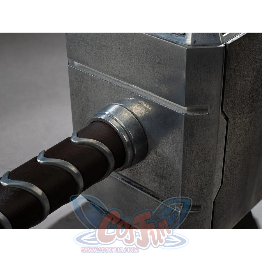 Thor cosplay hammer details the junction between the weathered metal head and the coiled grip wrapped in dark material.