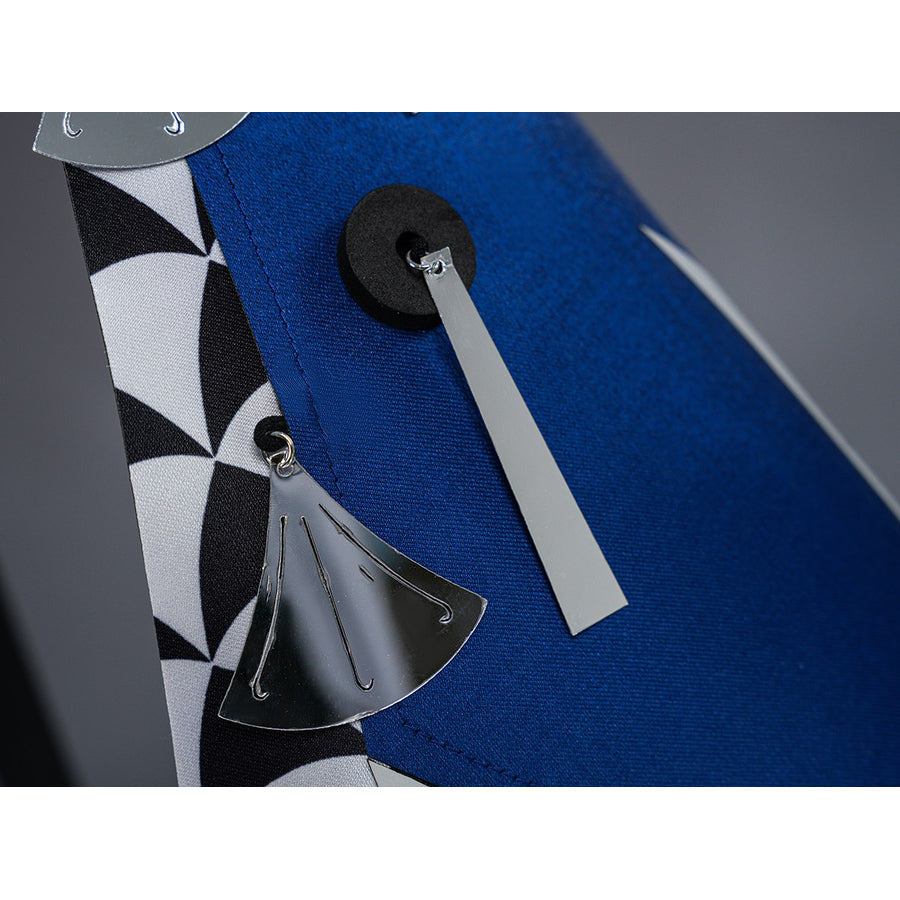 Velina Airgid cosplay back waist accessory detail features a silver tassel hanging from the blue side panel.