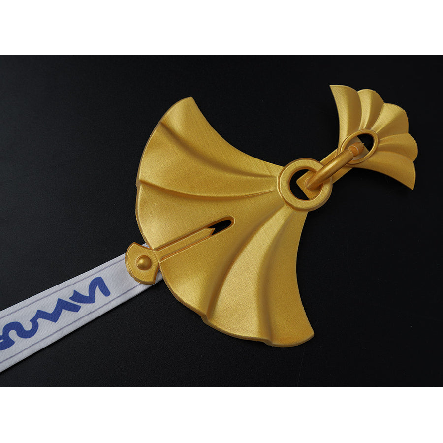 Velina Airgid cosplay hair bow detail focuses on the gold bow accessory and attached white patterned strip.