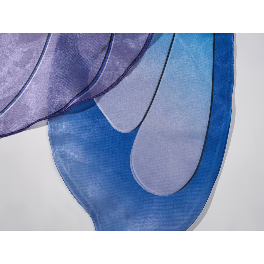 Velina Airgid cosplay costume layers smooth blue and purple satin fabric with bold black outlines on the capelet trim.