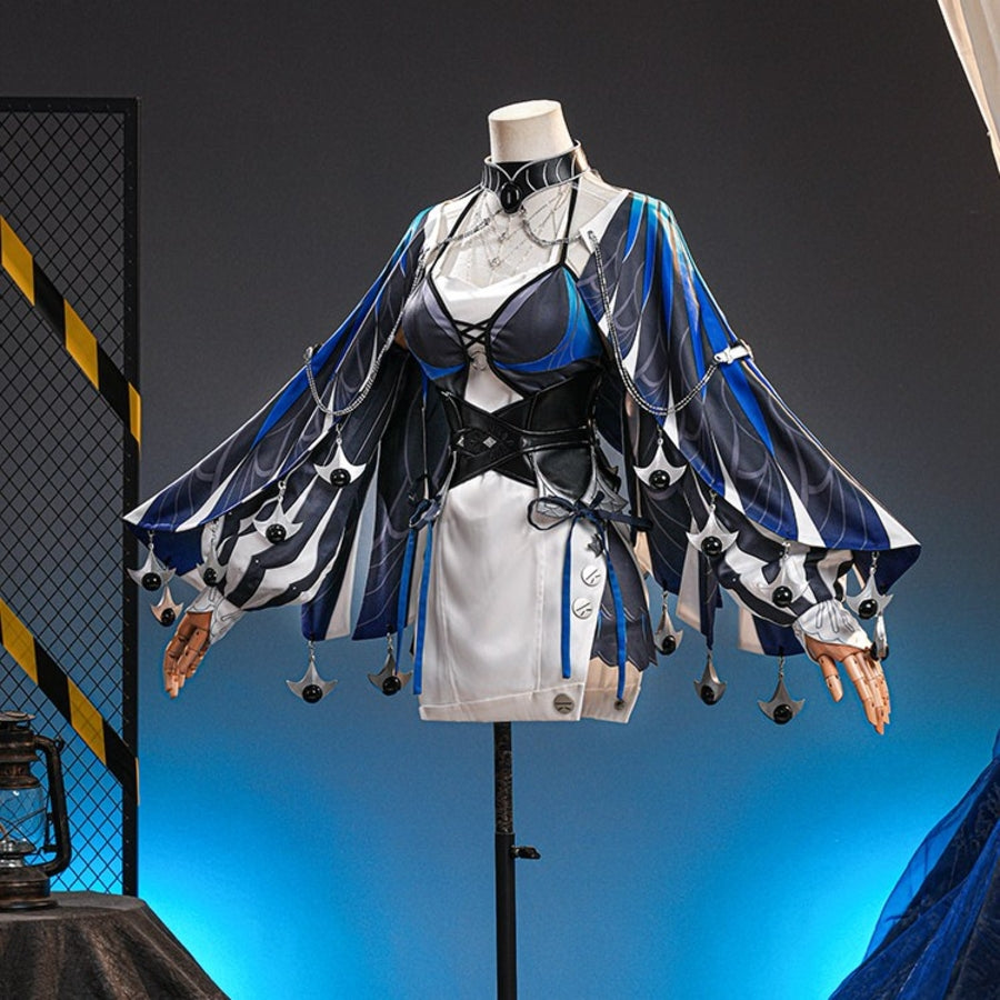 Velina Airgid cosplay costume layers a flowing blue capelet over a strapless dress and corset set with silver-tone chains.