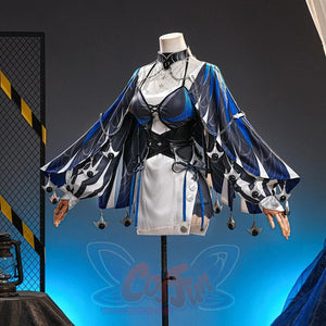 Velina Airgid cosplay costume layers a flowing blue capelet over a strapless dress and corset set with silver-tone chains.