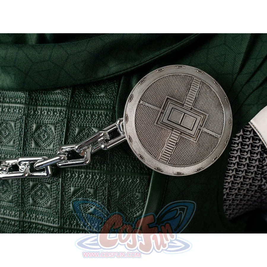Victor Von Doom cosplay costume anchors a round cape brooch and chain across textured green chest armor.
