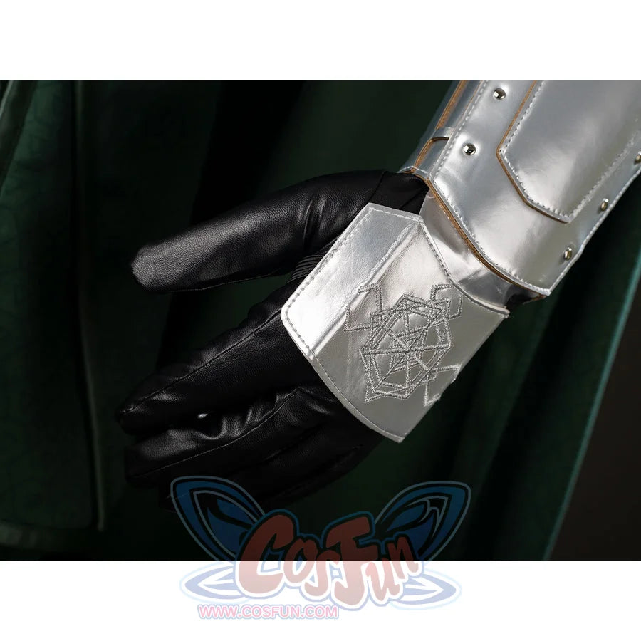 Victor Von Doom cosplay costume highlights the etched wrist guard above a black glove and green cape fold.