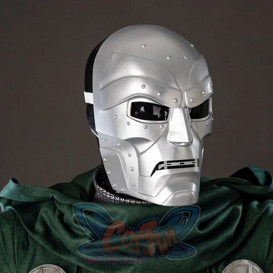 Victor Von Doom cosplay mask centers riveted silver-tone face armor above a green scarf and costume trim.