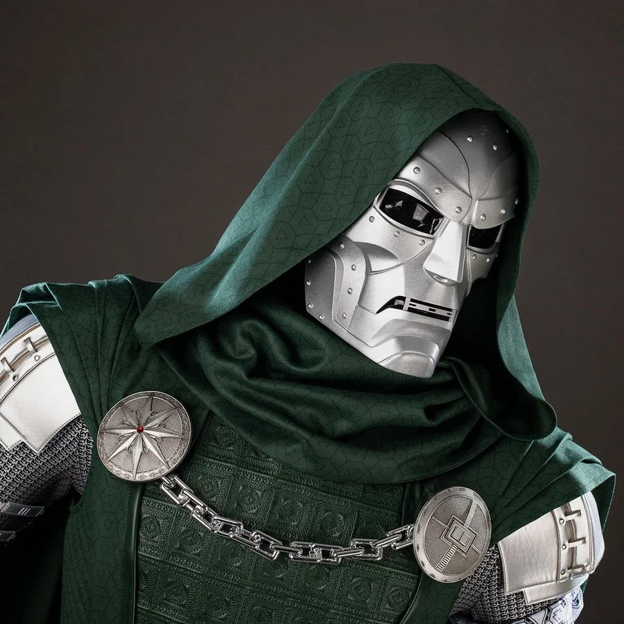 COSFUN Victor Von Doom cosplay mask sits beneath a green patterned hood with silver-tone riveted face panels.