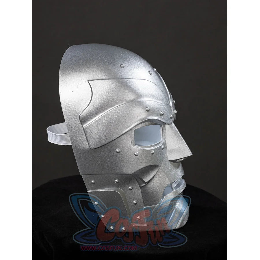 Victor Von Doom cosplay mask side profile curves from the riveted brow to layered cheek and jaw panels.