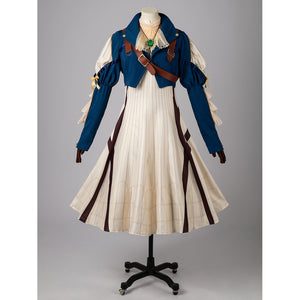 Violet Evergarden cosplay costume centers blue jacket with brown straps over a cream pinstriped dress with gem-like.