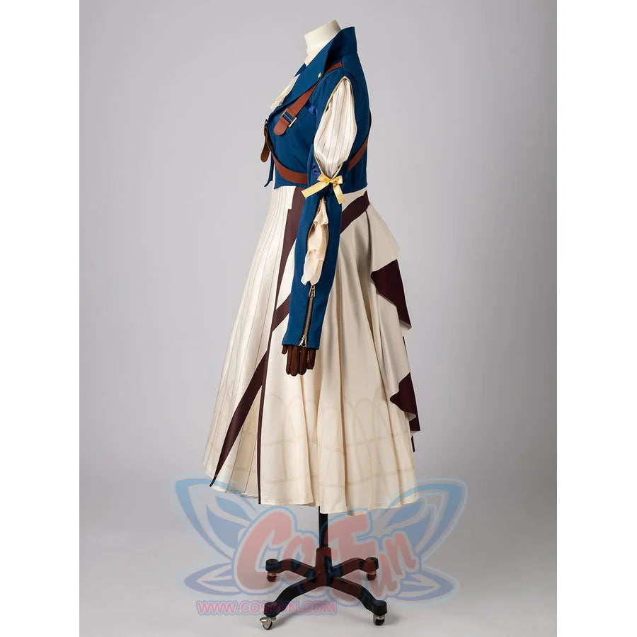 Violet Evergarden cosplay costume frames a blue jacket with brown straps layered over a patterned cream pleated dress.