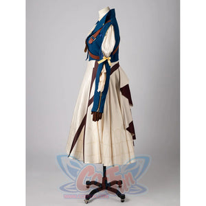 Violet Evergarden cosplay costume frames a blue jacket with brown straps layered over a patterned cream pleated dress.