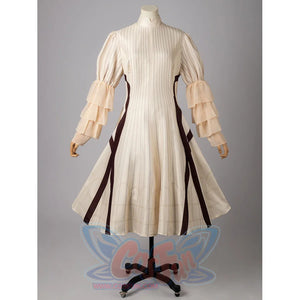 Violet Evergarden cosplay costume pairs a striped dress with gathered ruffle sleeve layers and dark vertical paneling.